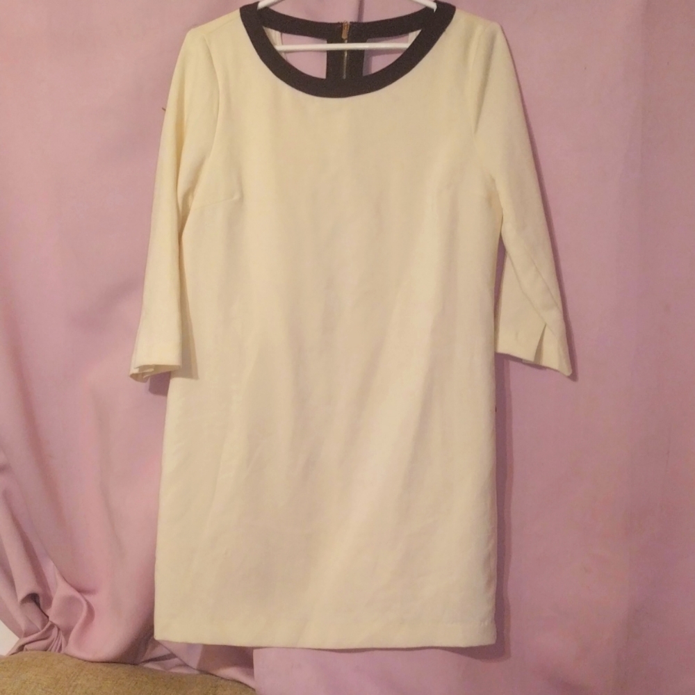 4/$20 Gorgeous cream colored dress with cutouts and black trim-M